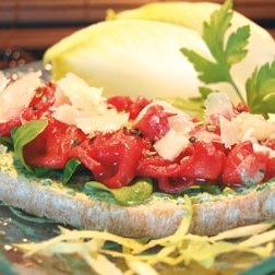 Beef Carpaccio open sandwich with rocket mousse, olive oil and Parmesan - 